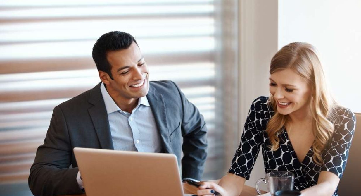 Businessman,,Woman,And,Conversation,With,Laptop,In,Office,For,Real